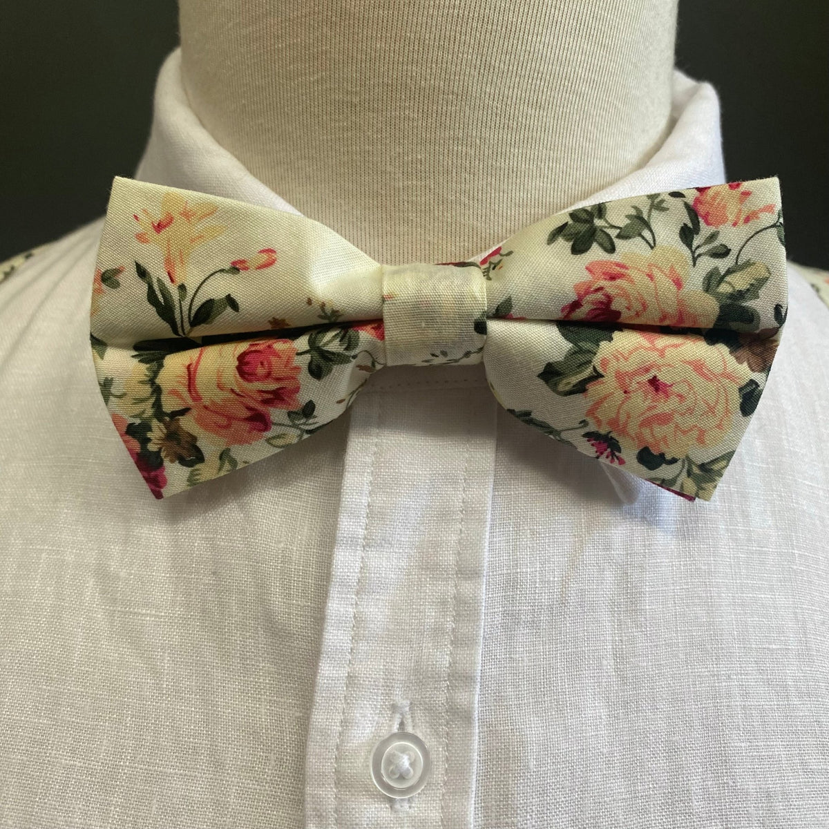 cream bow tie and suspenders